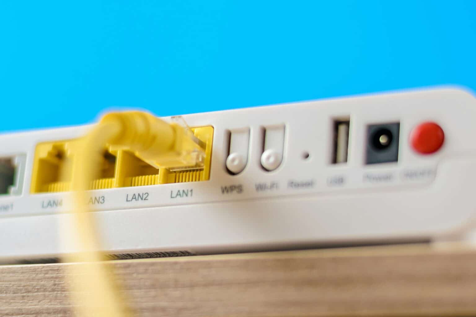 modern internet router with connecting cable, closeup