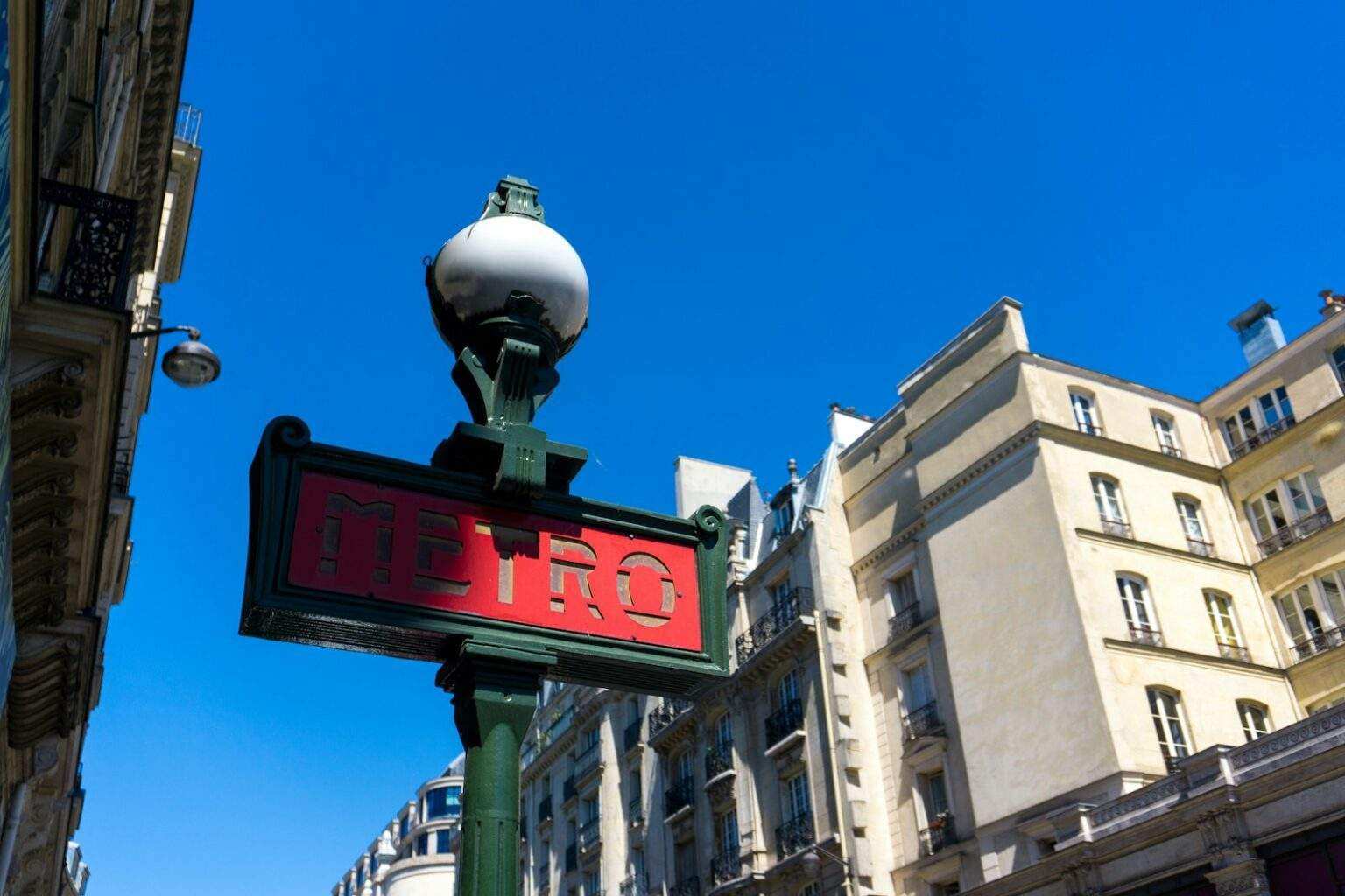a street sign on a pole in front of a building