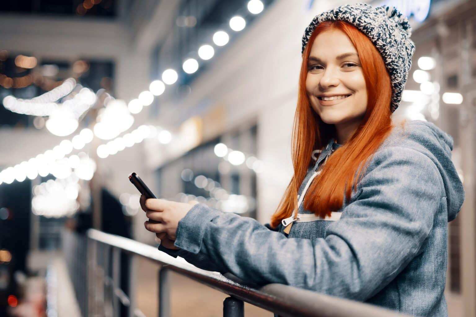 Woman using mobile phone outdoors