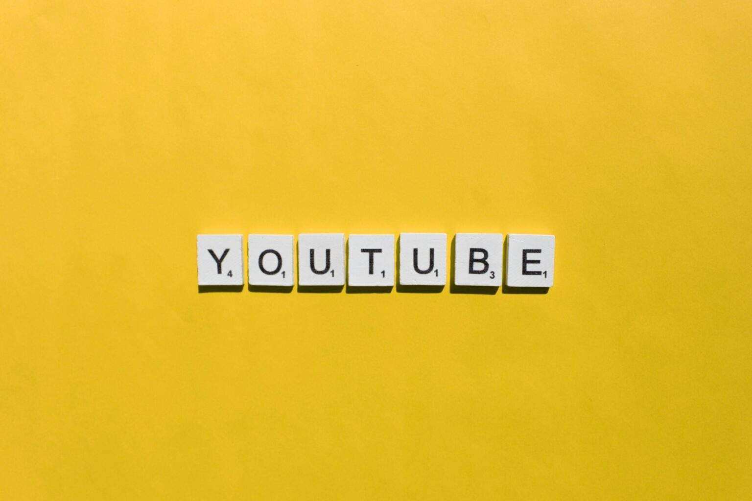 YouTube scrabble letters word on a yellow background