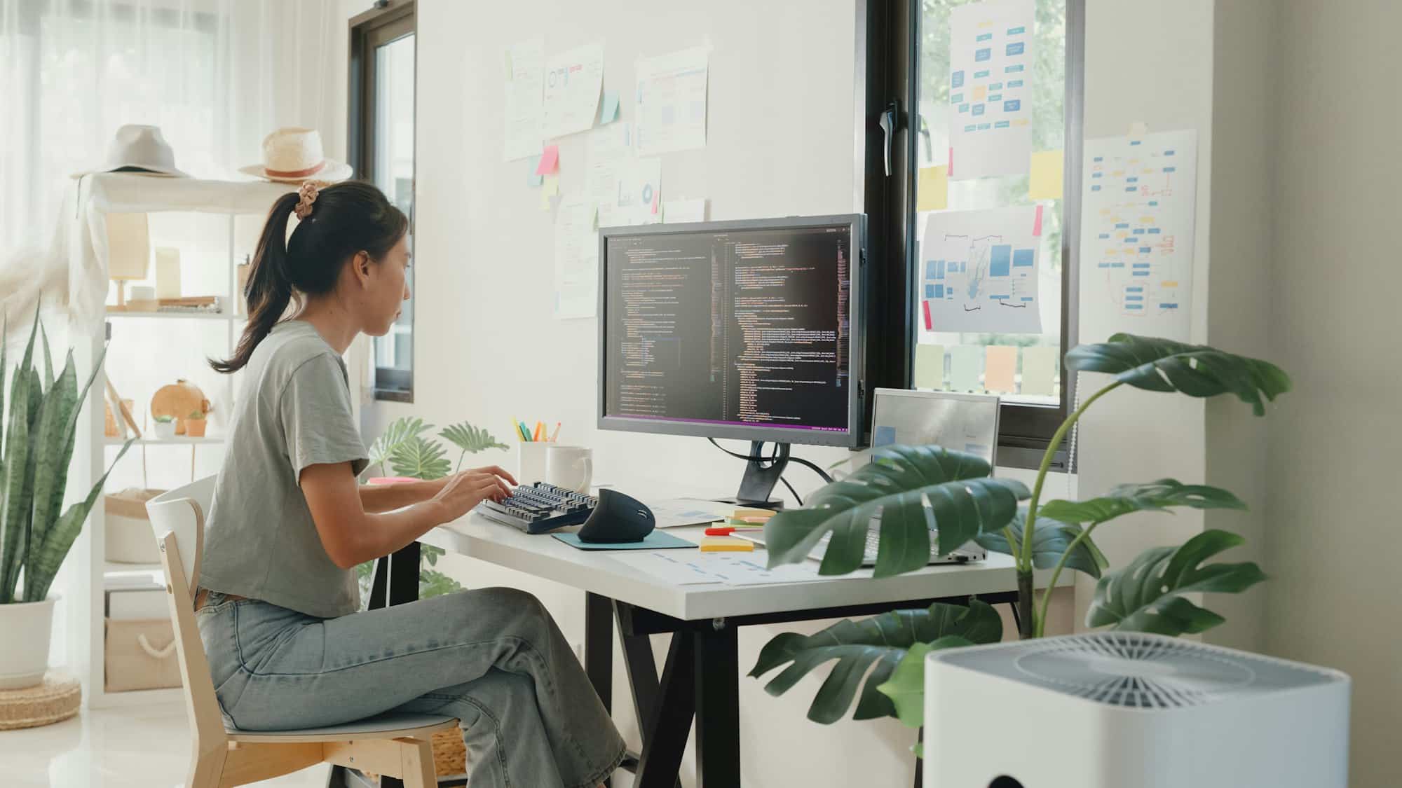 girl IT development programmer typing on keyboard coding programming fixing data code.