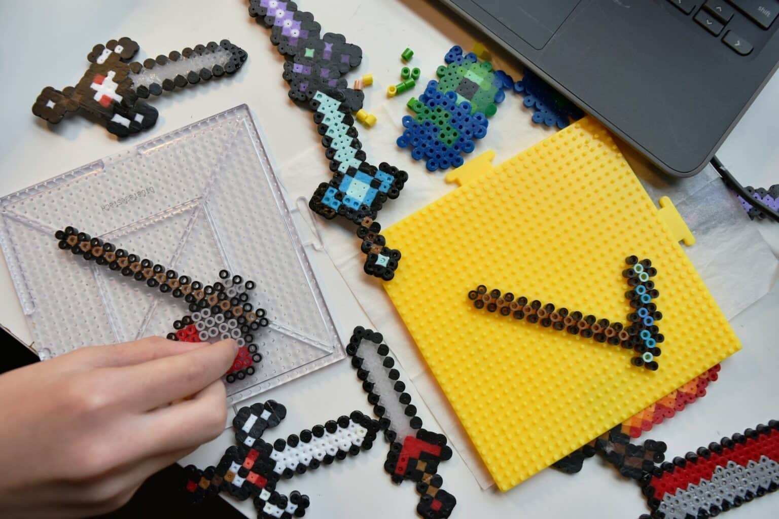 Hobby flat lay. Minecraft inspired pixel art with fusible beads flatlay dexterity fine motor skills