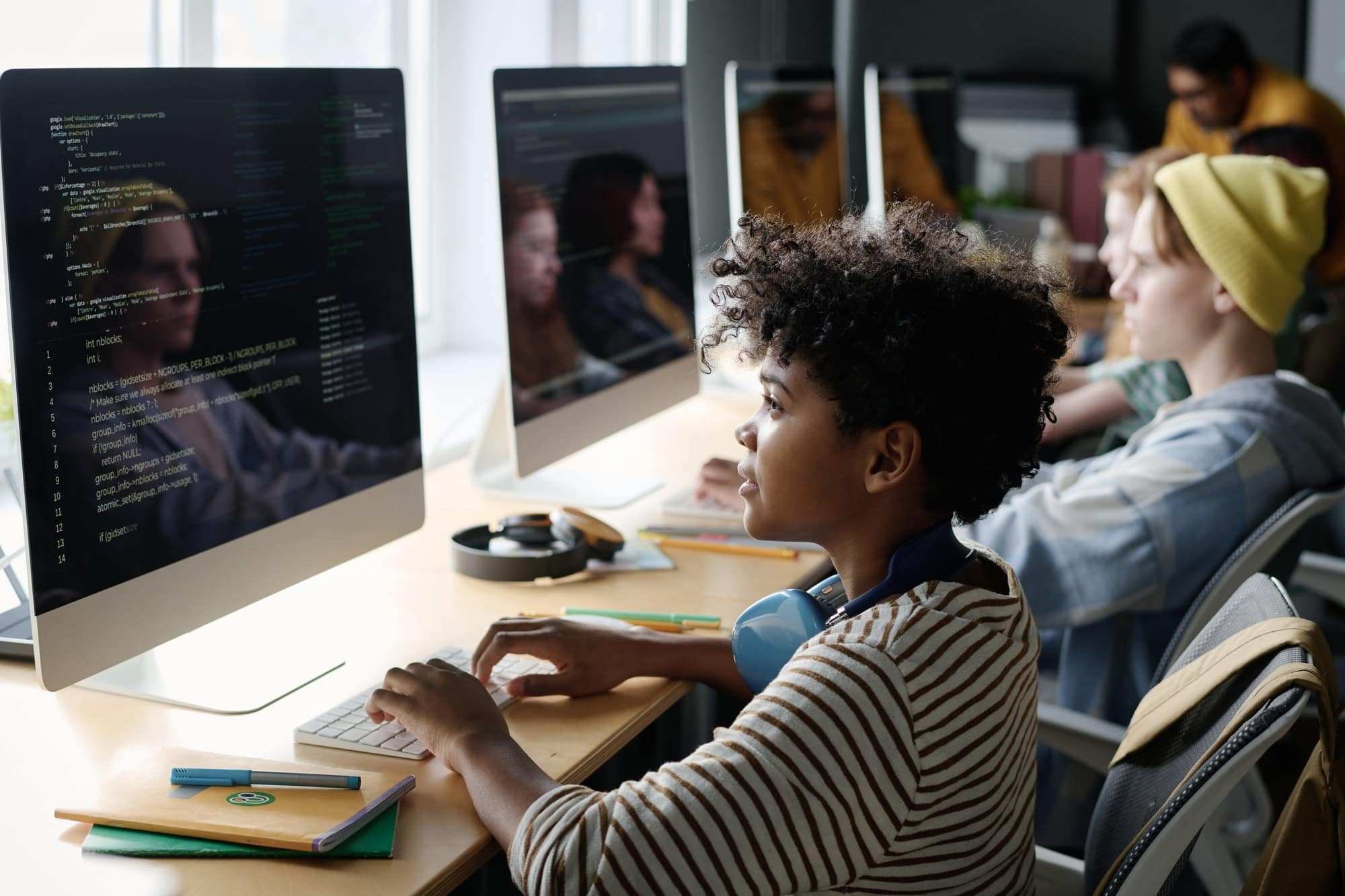 Black Boy Coding on Computer in Class