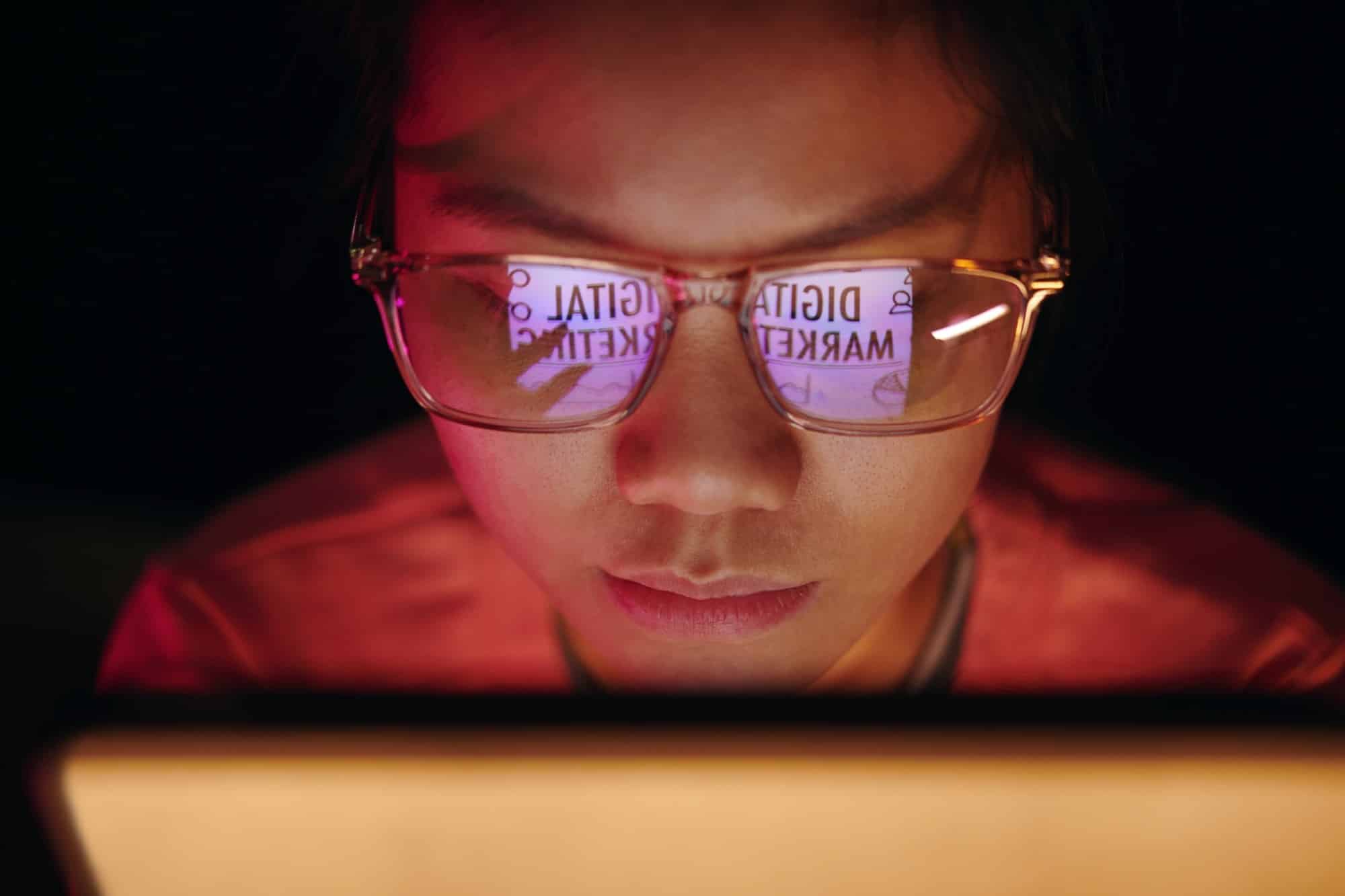 Focused Digital Marketer Analyzing Online Data