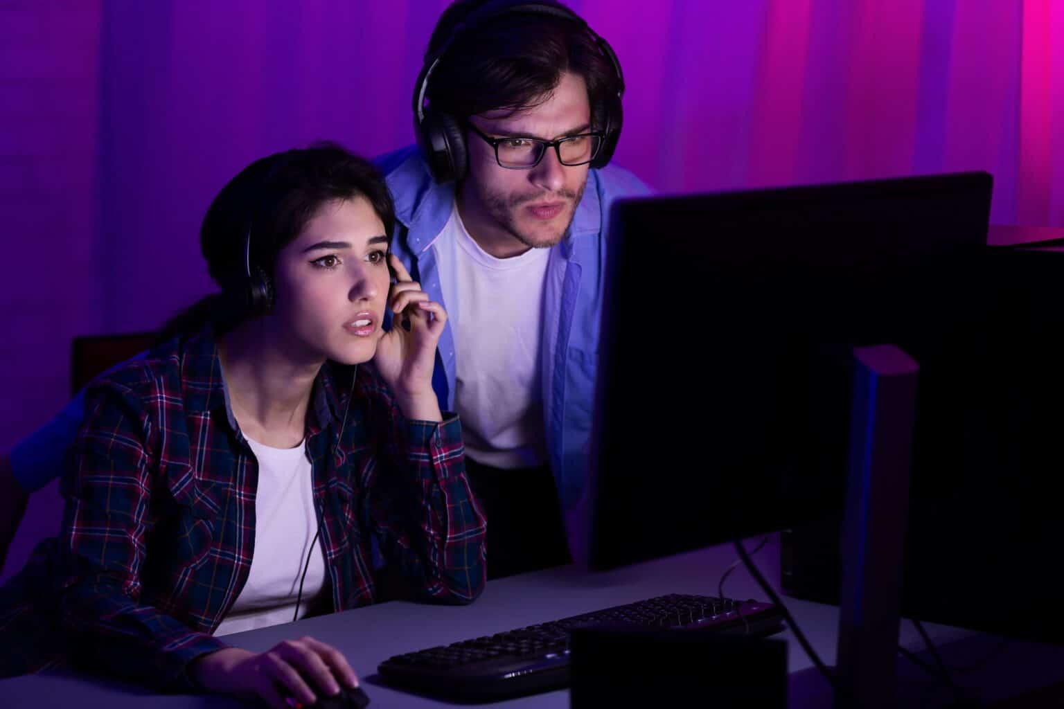 Gamers playing PC video game on eSport tournament