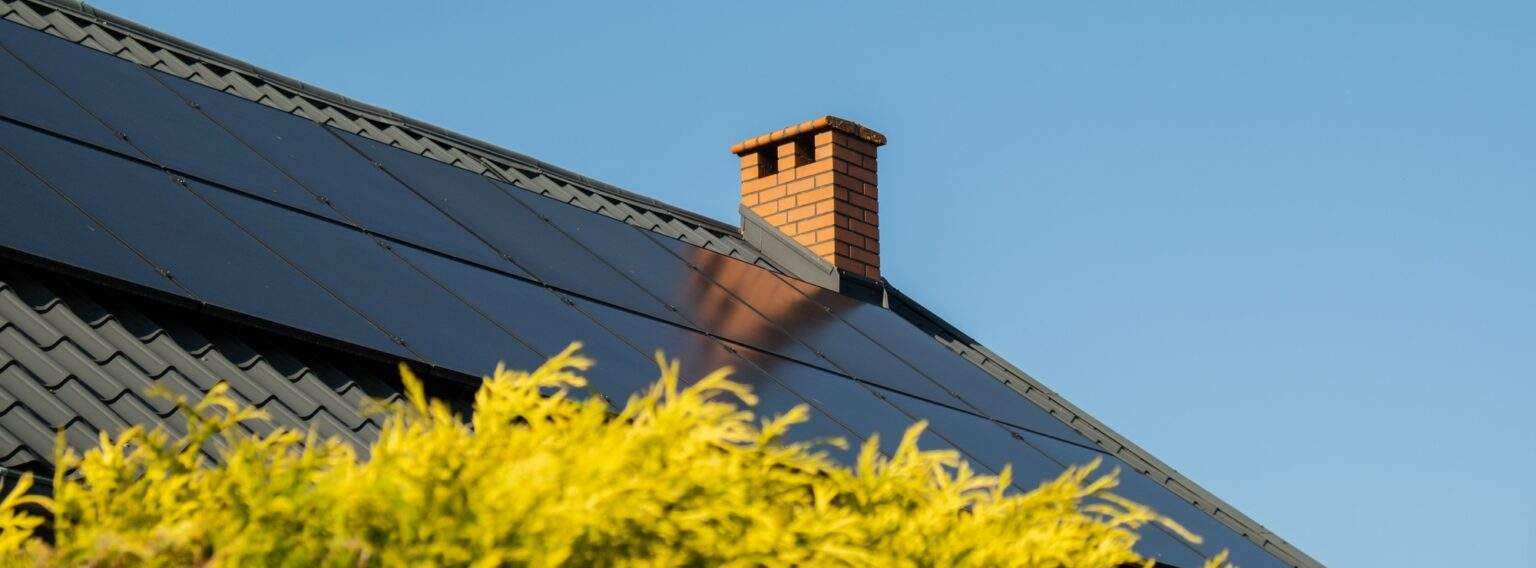 New ecologic house with solar panels Alternative to conventional energy. The battery is charged from