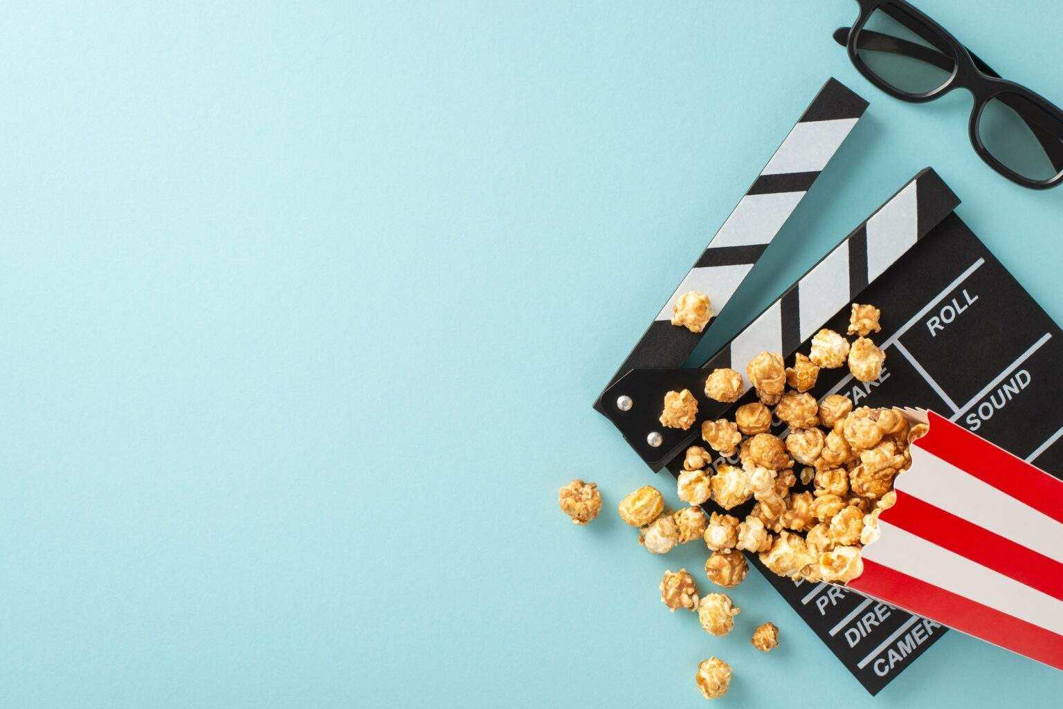 Awaiting the filmstrip's unveiling. Top view of a filmmaker's clapperboard, 3D glasses