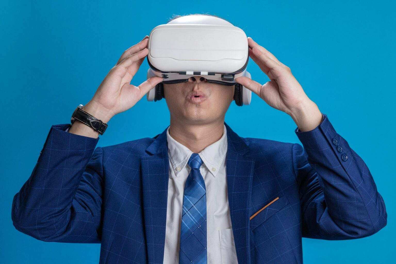 Businessman in VR headset controls virtual reality AI program to give instructions