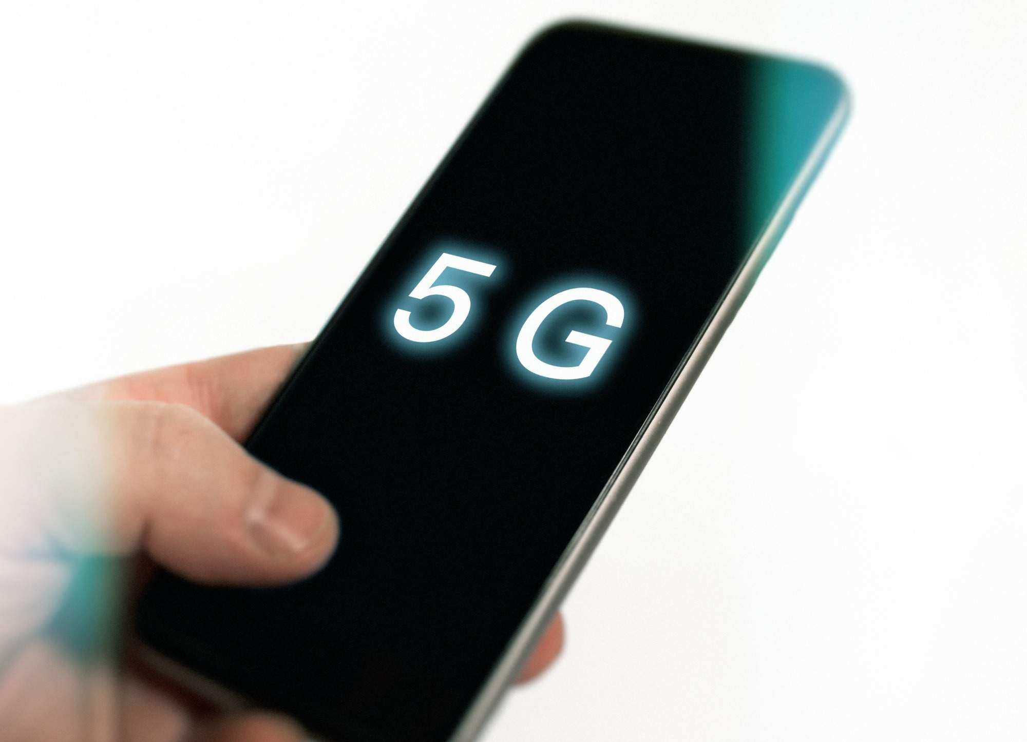 Cellphone in hand with 5G on display