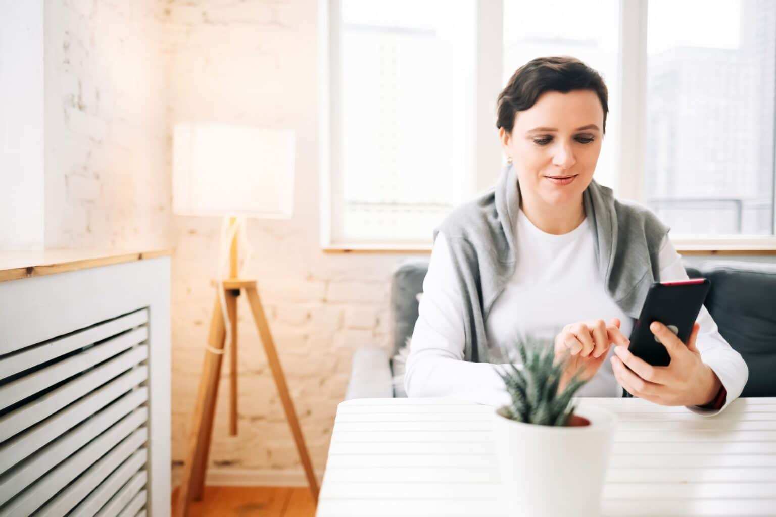 Woman reading messages on the phone