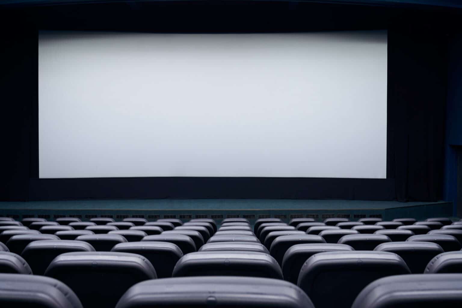 Blank screen and black seats in cinema hall