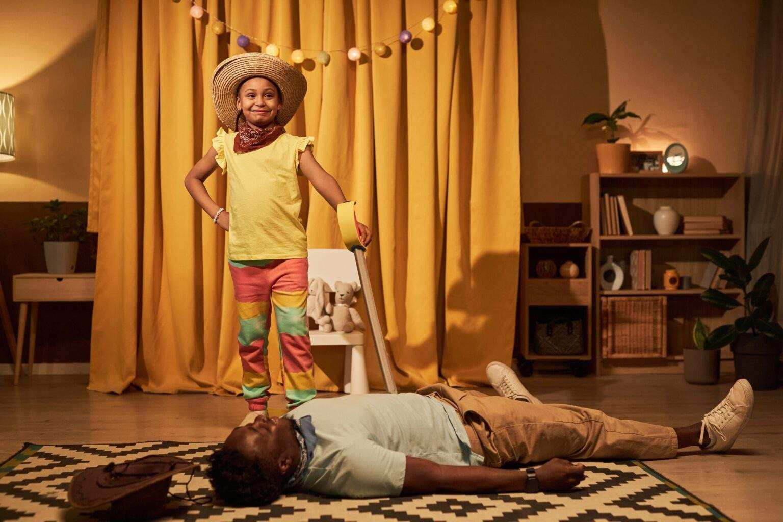 Black little girl defeating villain on stage