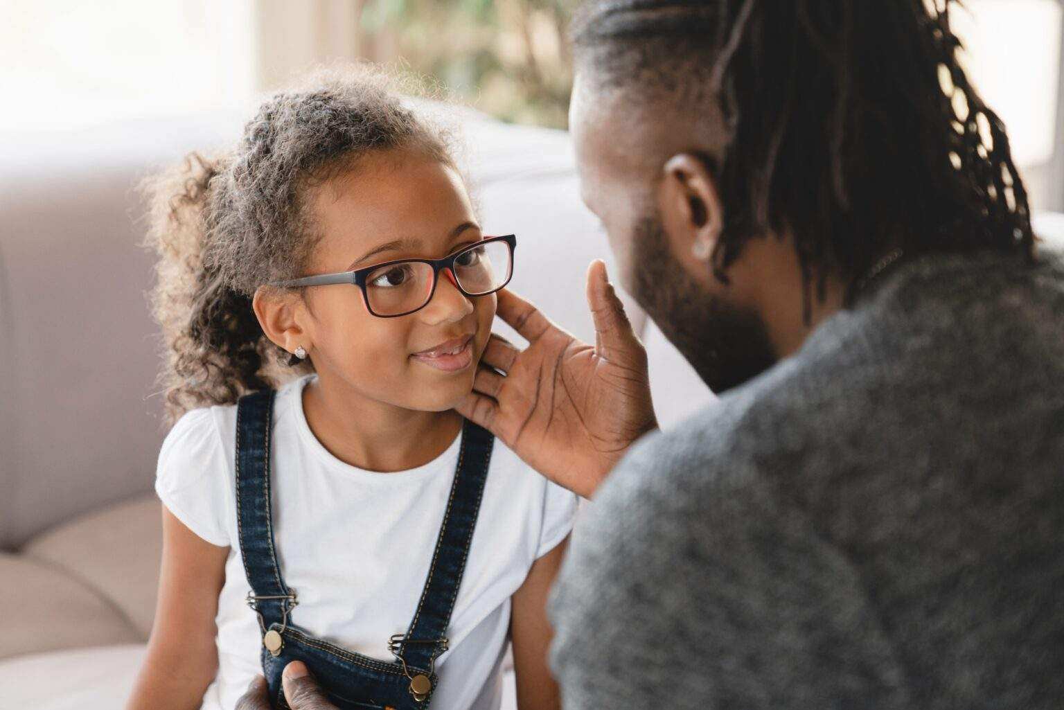 Dad nurturing daughter, having fun sharing love and care. Bonding in family relationship. Fatherhood