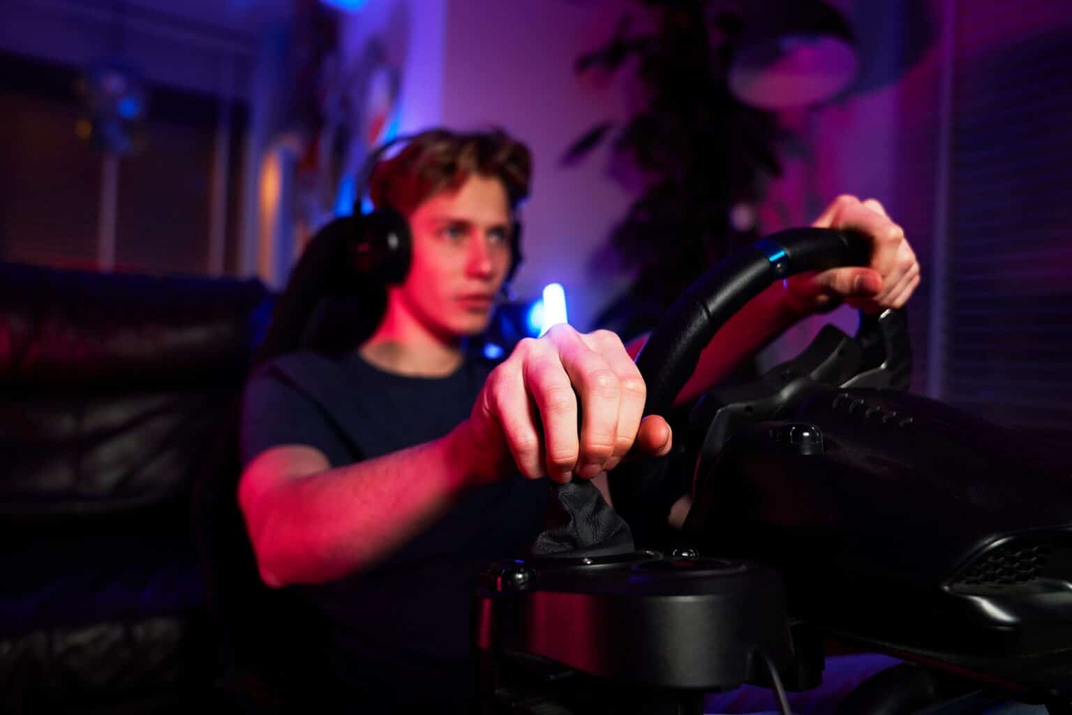 Caucasian man playing game using car simulator
