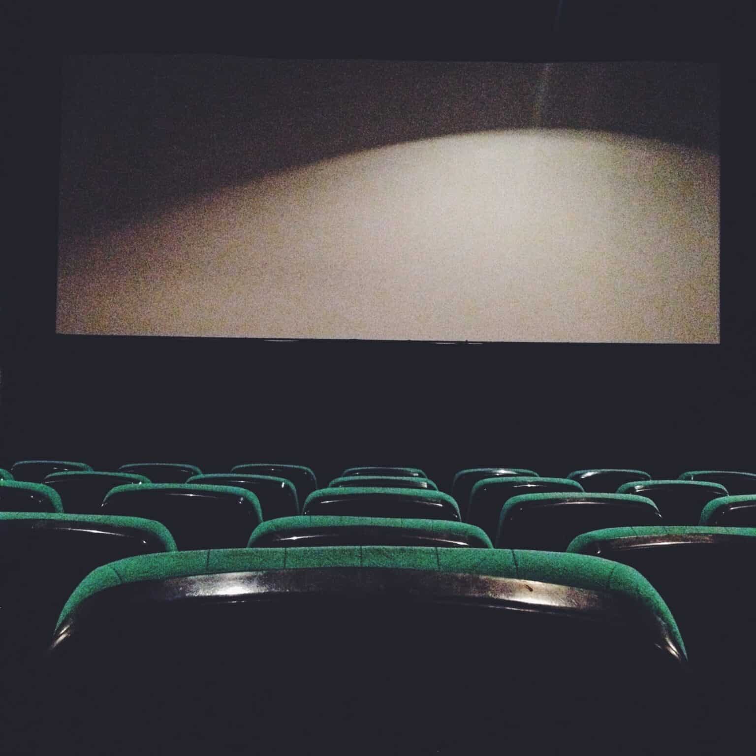 View of the seats and the cinema screen. Empty cinema hall.