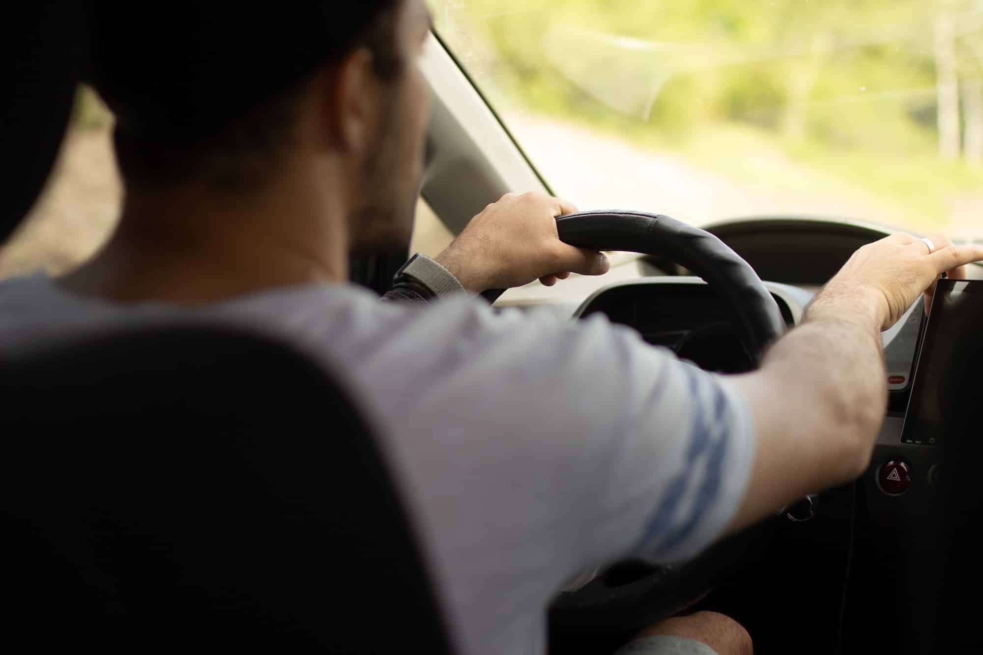 Friendly driver. Travel by car. The driver is driving. Travels.