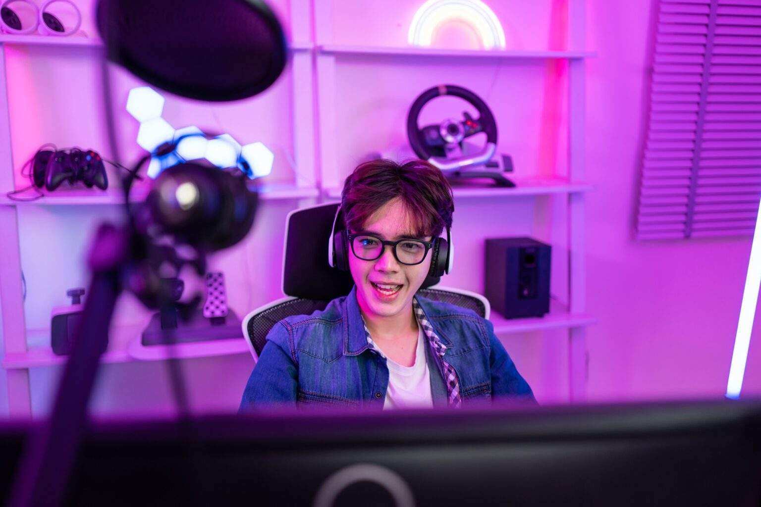 Asian attractive esport male gamer play online video game on computer.