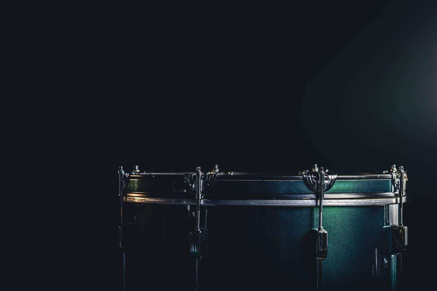 The floor tom on under studio lighting, copy space, music concept.