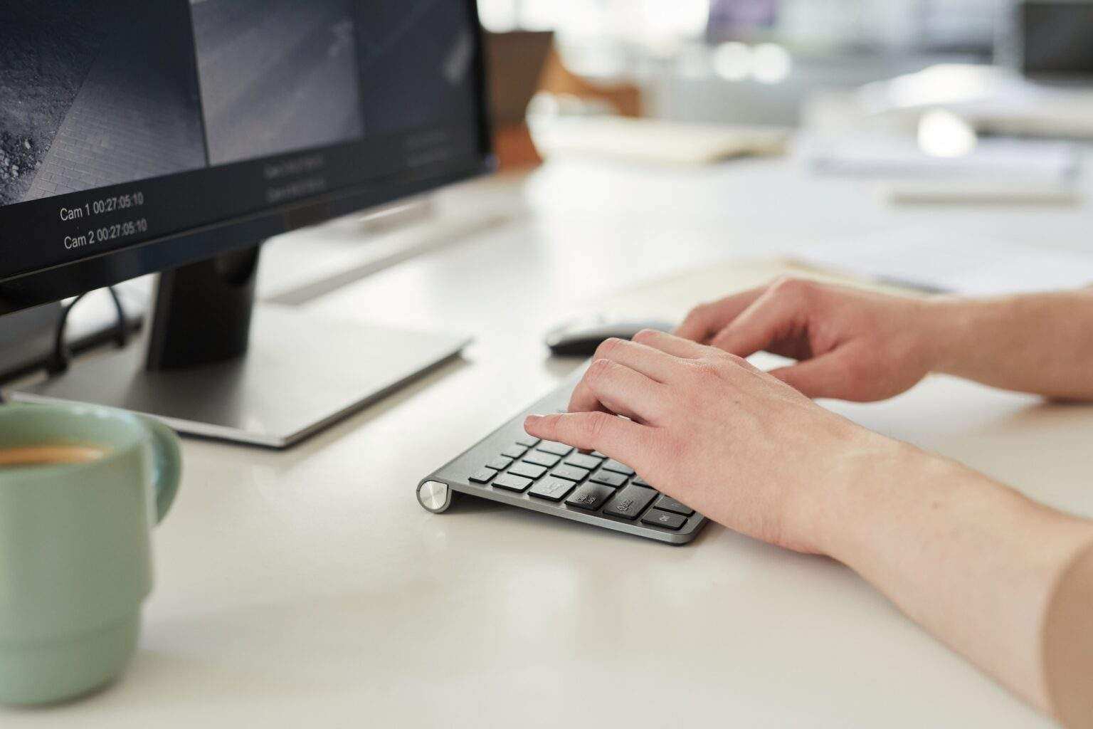 Young Asian man looking at camera with surveillance