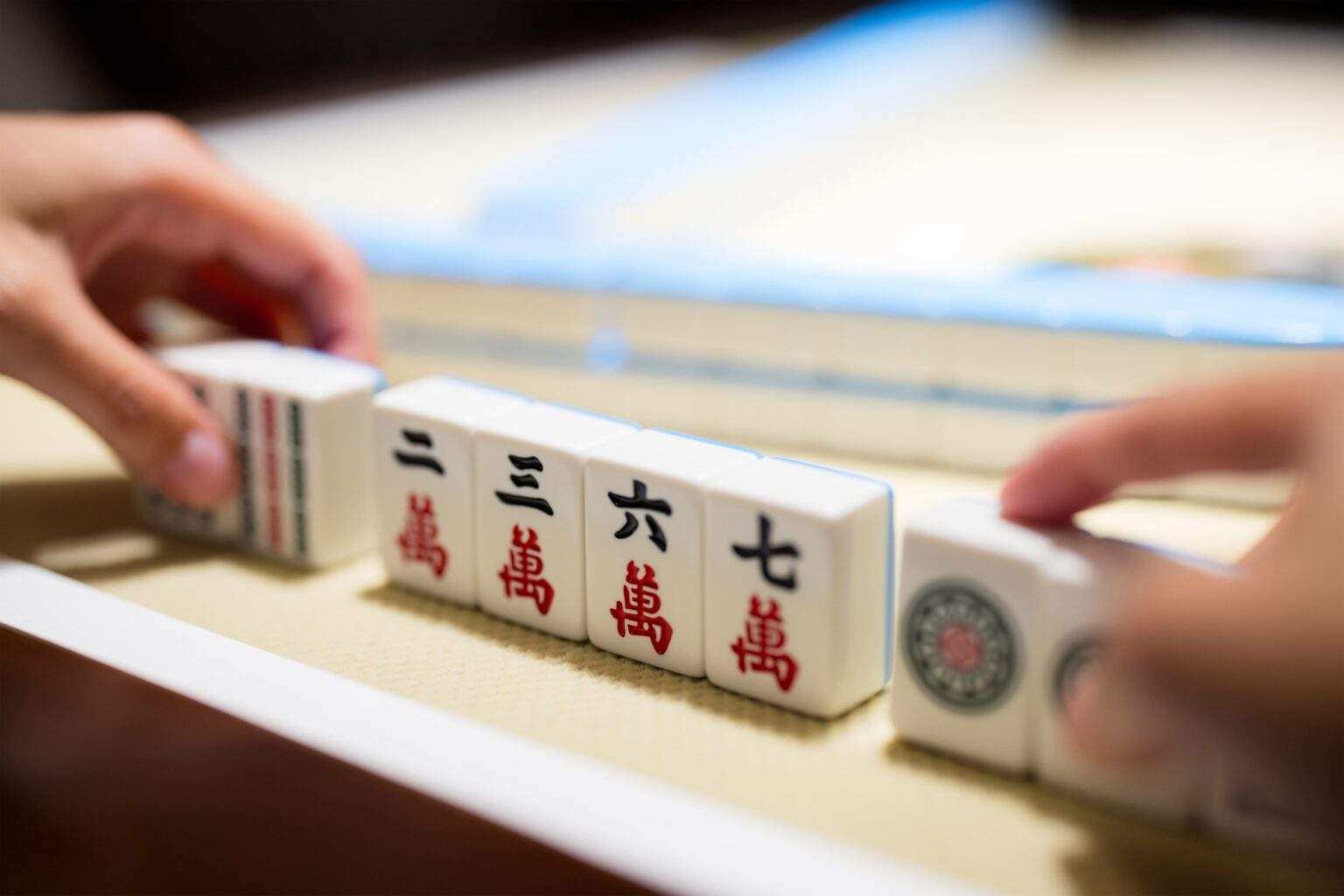Playing Mahjong on the table